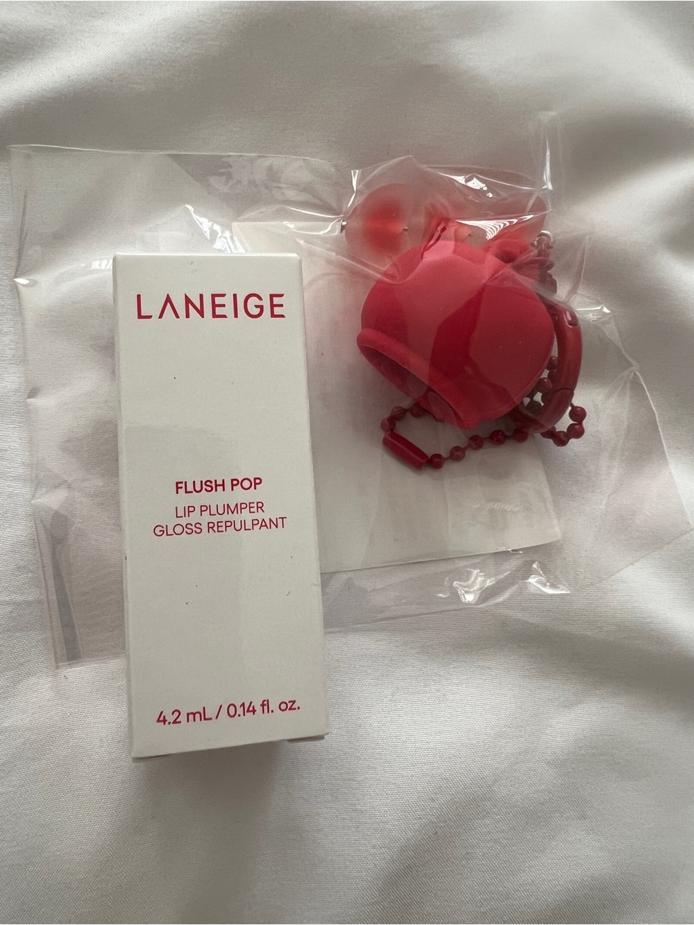 LANEIGE Flush Pop Lip Plumper Gloss with a keychain